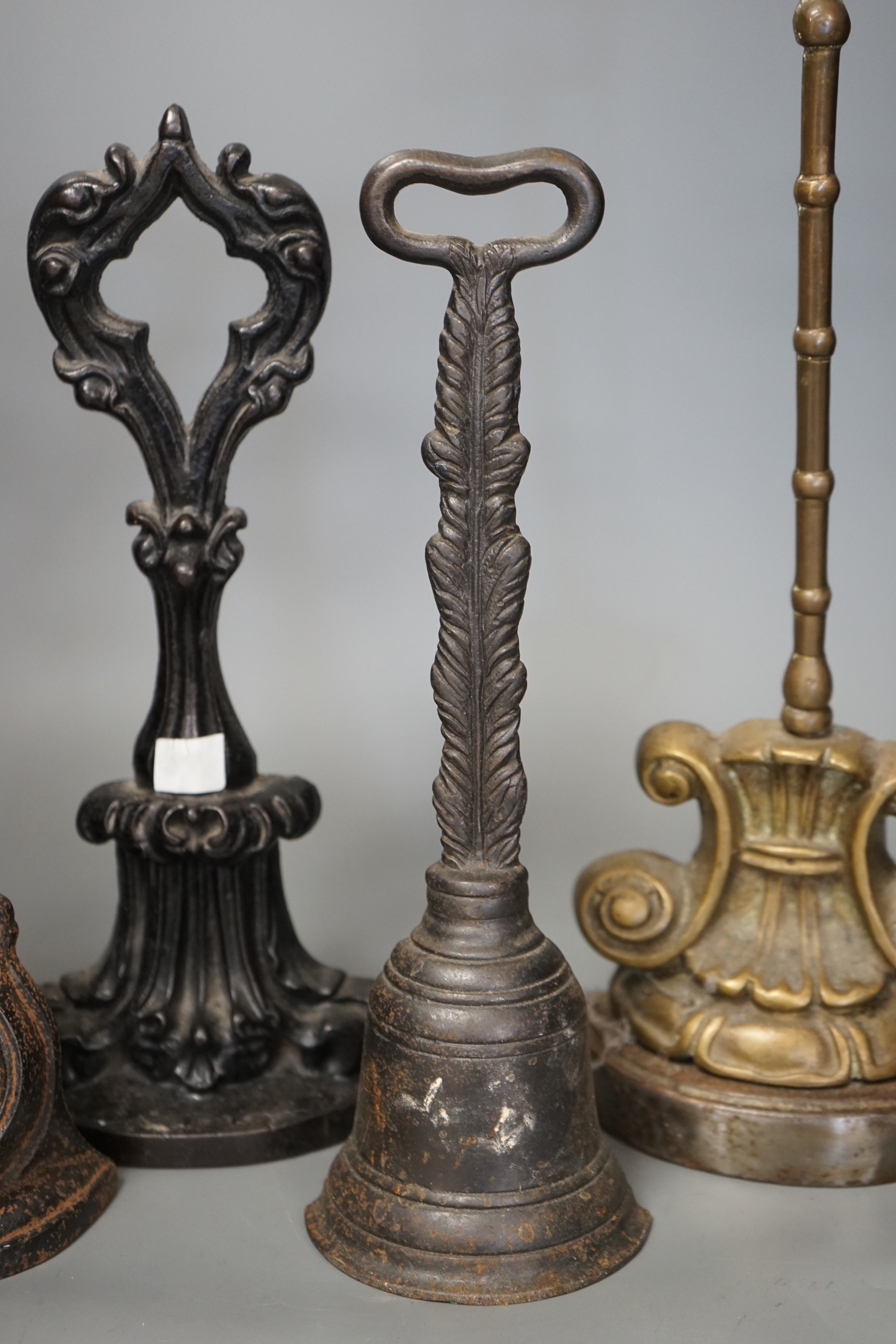 Four cast iron Victorian assorted door stops, tallest 38cm